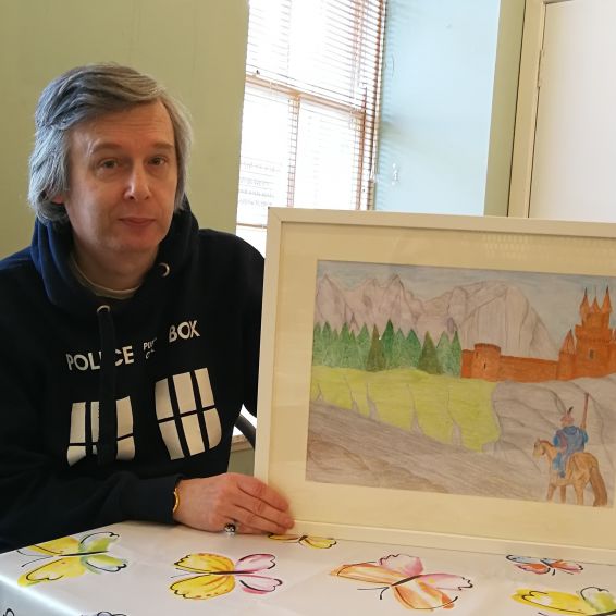 Ian McMonigle with his artwork
