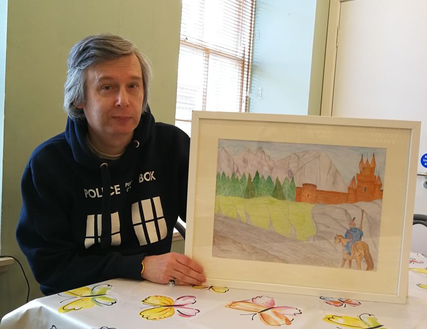 Ian McMonigle with his artwork
