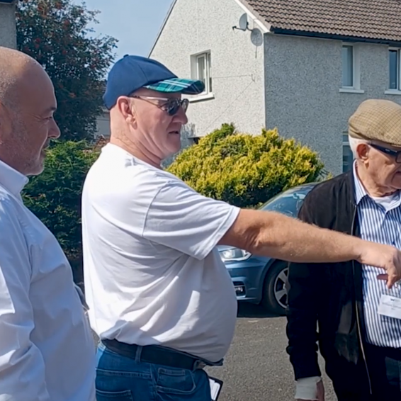 Eric Amato, Environmental Service Delivery Lead at Wheatley Homes South with tenants in Lochside